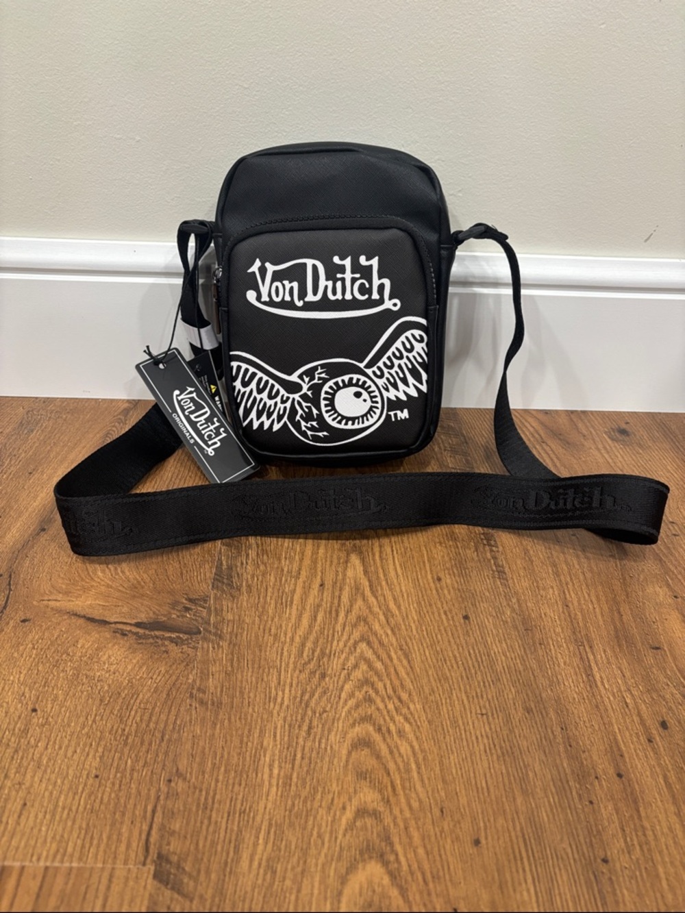 Von Dutch Black Crossbody Sling Bag with White Logo and Eyeball Wing Graphic